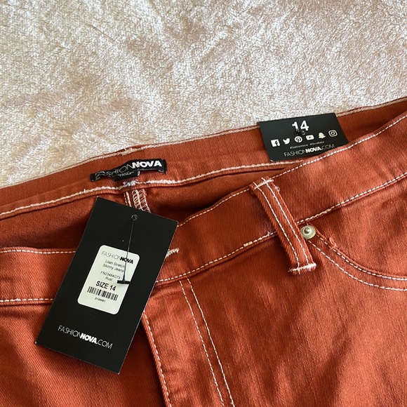 Lilac stretch skinny Jean. These are in a rust orange color w/ white stitching. - Picture 2 of 4